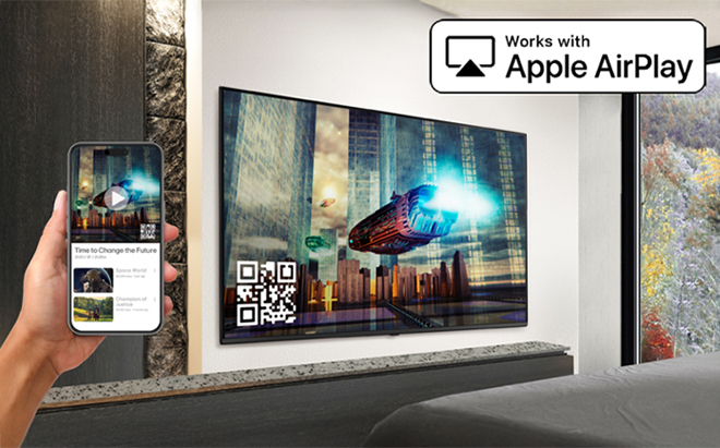 The image demonstrates that the AirPlay feature allows content from an iPhone to be displayed on the hotel TV.
