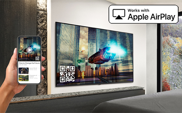 The image demonstrates that the AirPlay feature allows content from an iPhone to be displayed on the hotel TV.